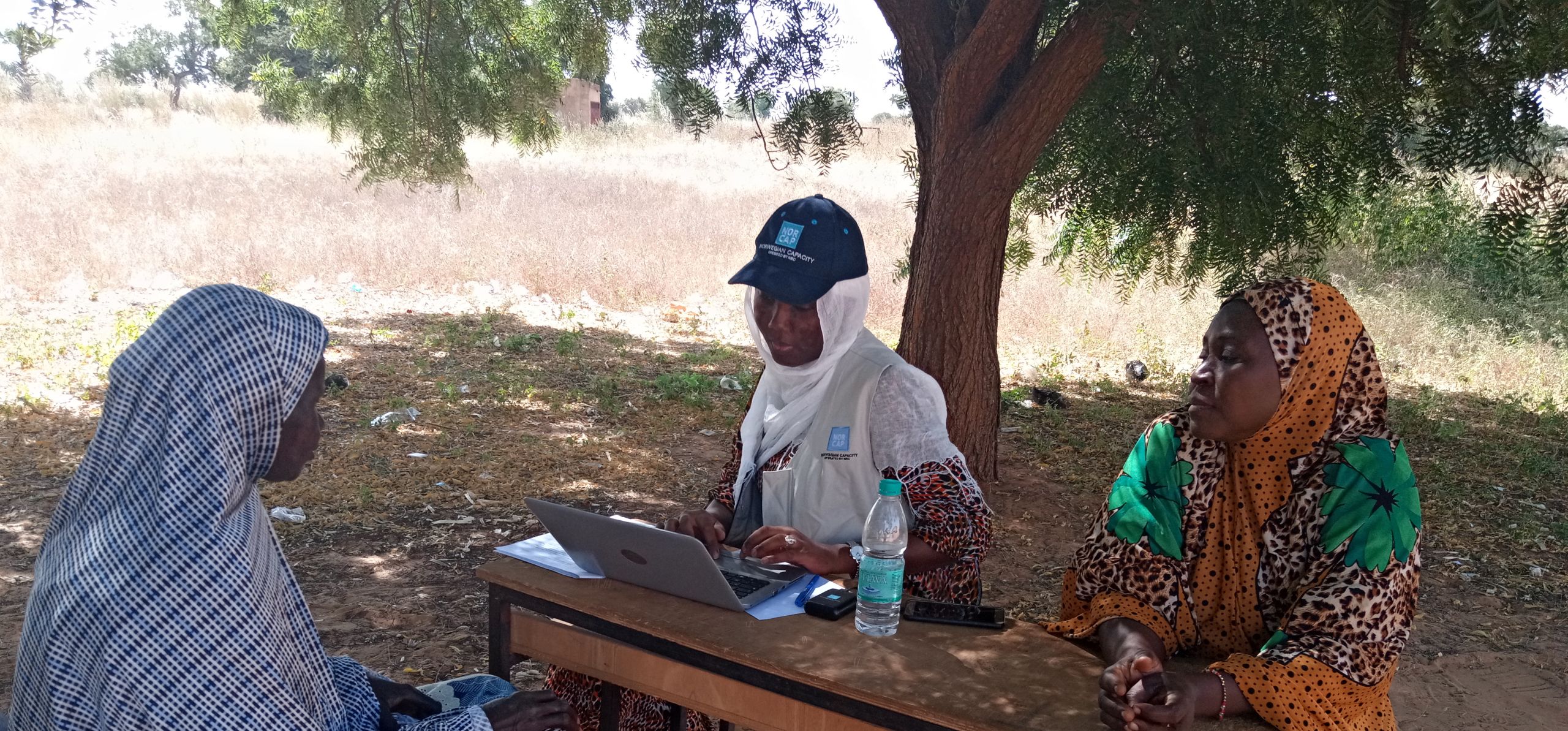 Climate expert Yacine Fall interviewing the leader of a women’s group called FARHA in Tessa commune, Niger, on the subject of women’s access to climate services.
